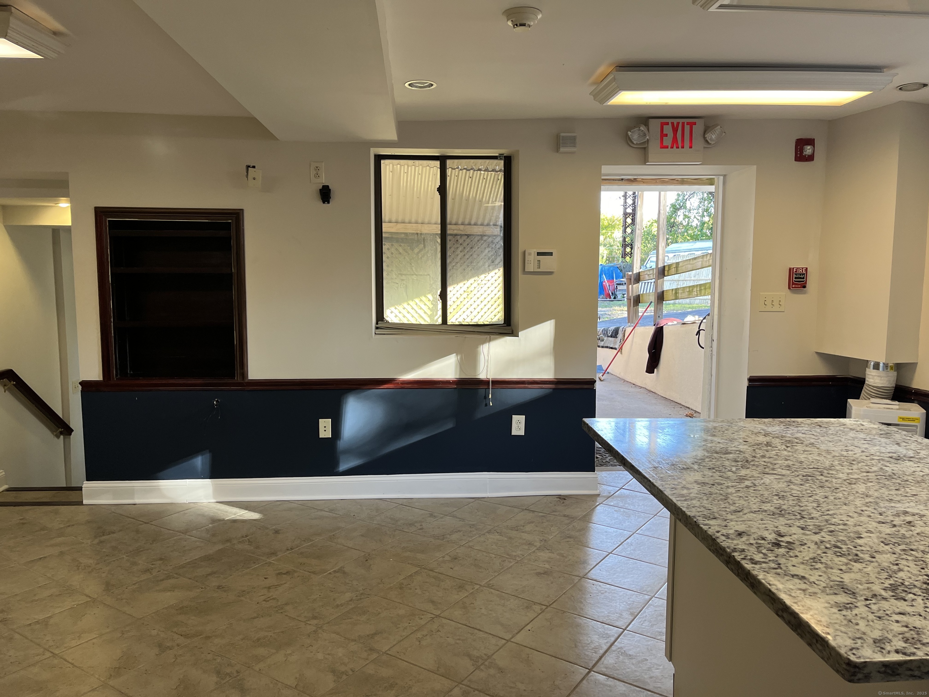 1397-1399 State Street, Unit 6 New Haven, CT 06511 - Photo 5 of 13 a living room with granite countertop furniture and a large window