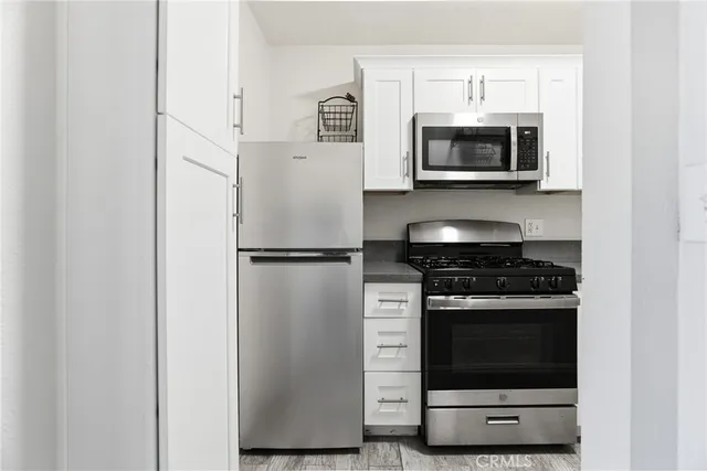a kitchen with a stove and a microwave