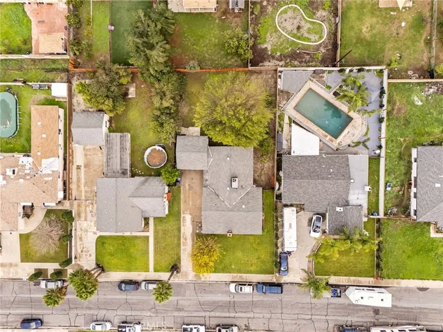 aerial view of a brick building with swimming pool