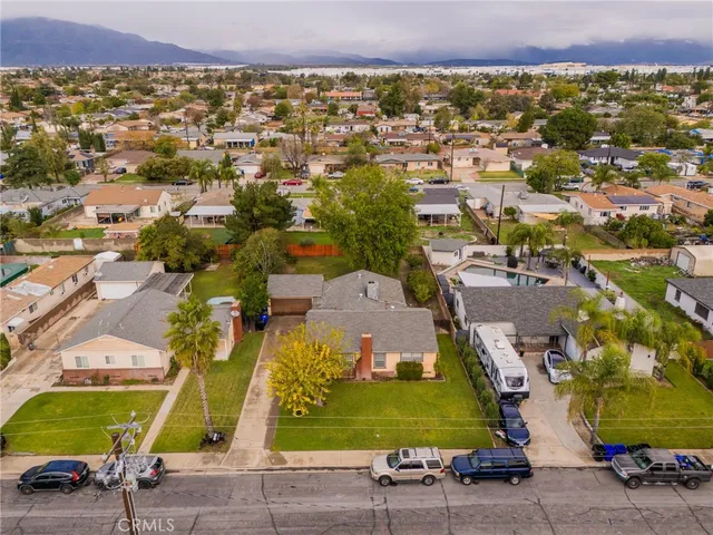 an aerial view of residential building and car parked