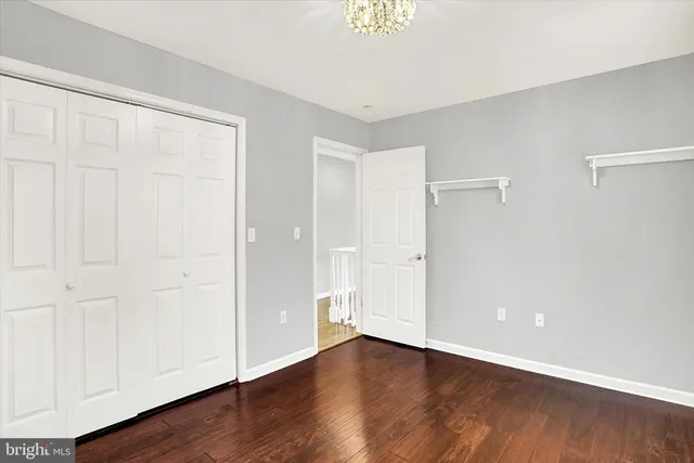 a view of room with window and wooden floor