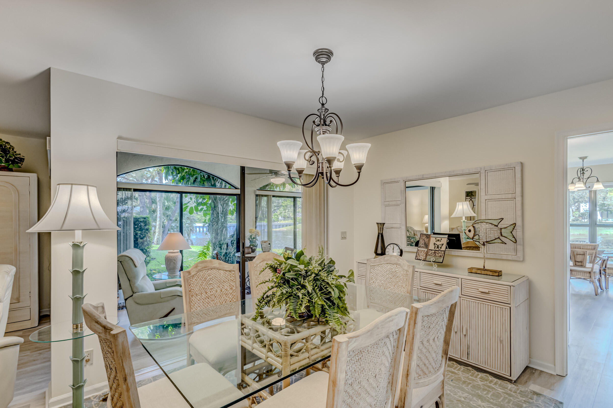 16623 Traders Crossing North, Unit 131 Jupiter, FL 33477 - Photo 11 of 42 a very nice looking dining room with a table and chairs