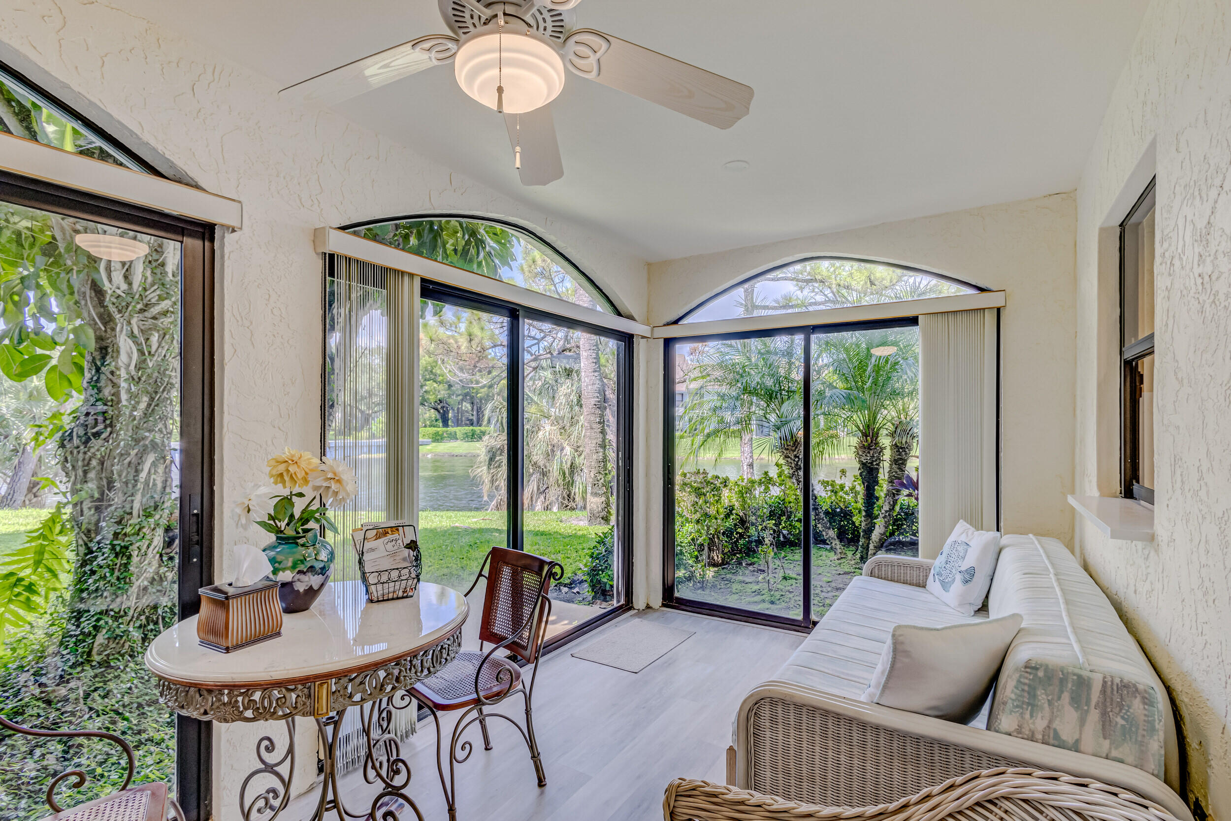 16623 Traders Crossing North, Unit 131 Jupiter, FL 33477 - Photo 18 of 42 a living room with furniture and a large window