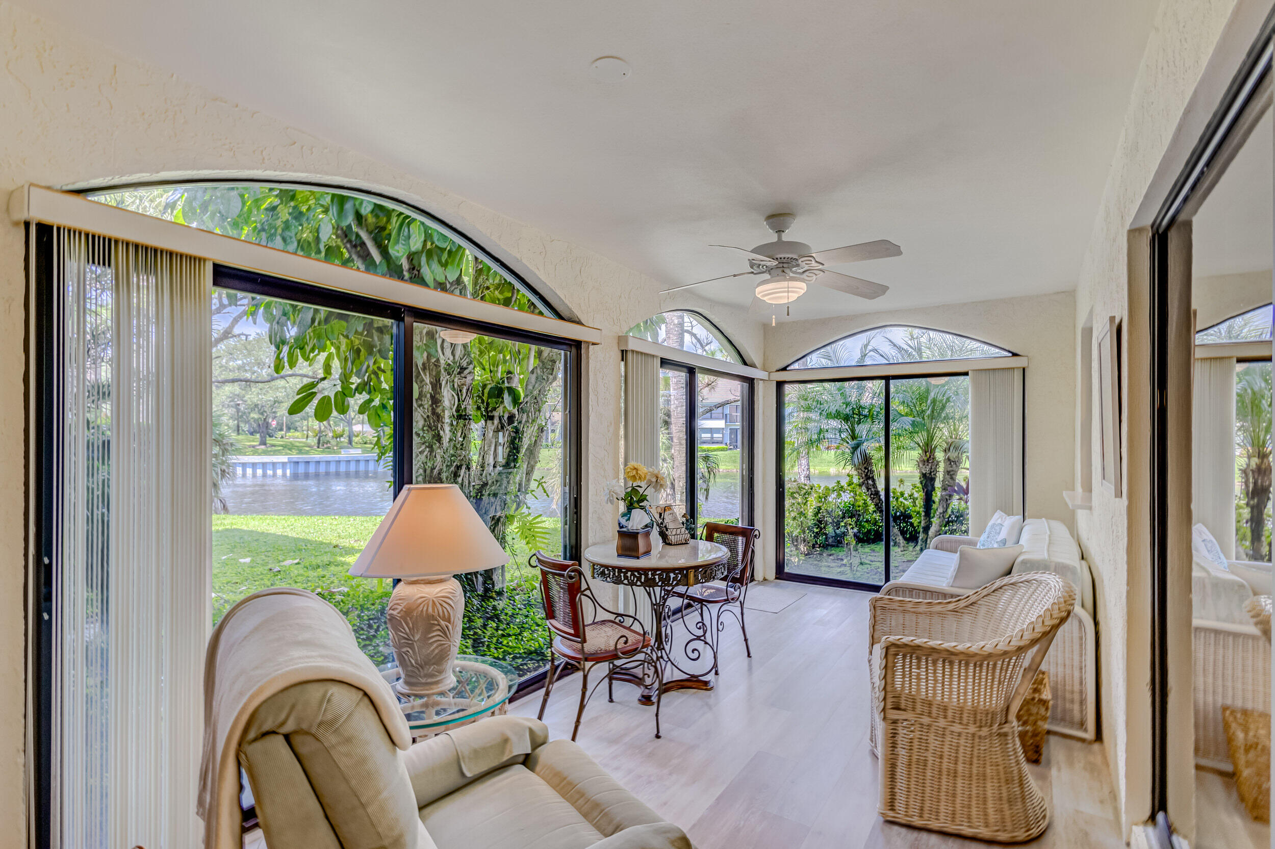 16623 Traders Crossing North, Unit 131 Jupiter, FL 33477 - Photo 19 of 42 a living room with furniture and a large window