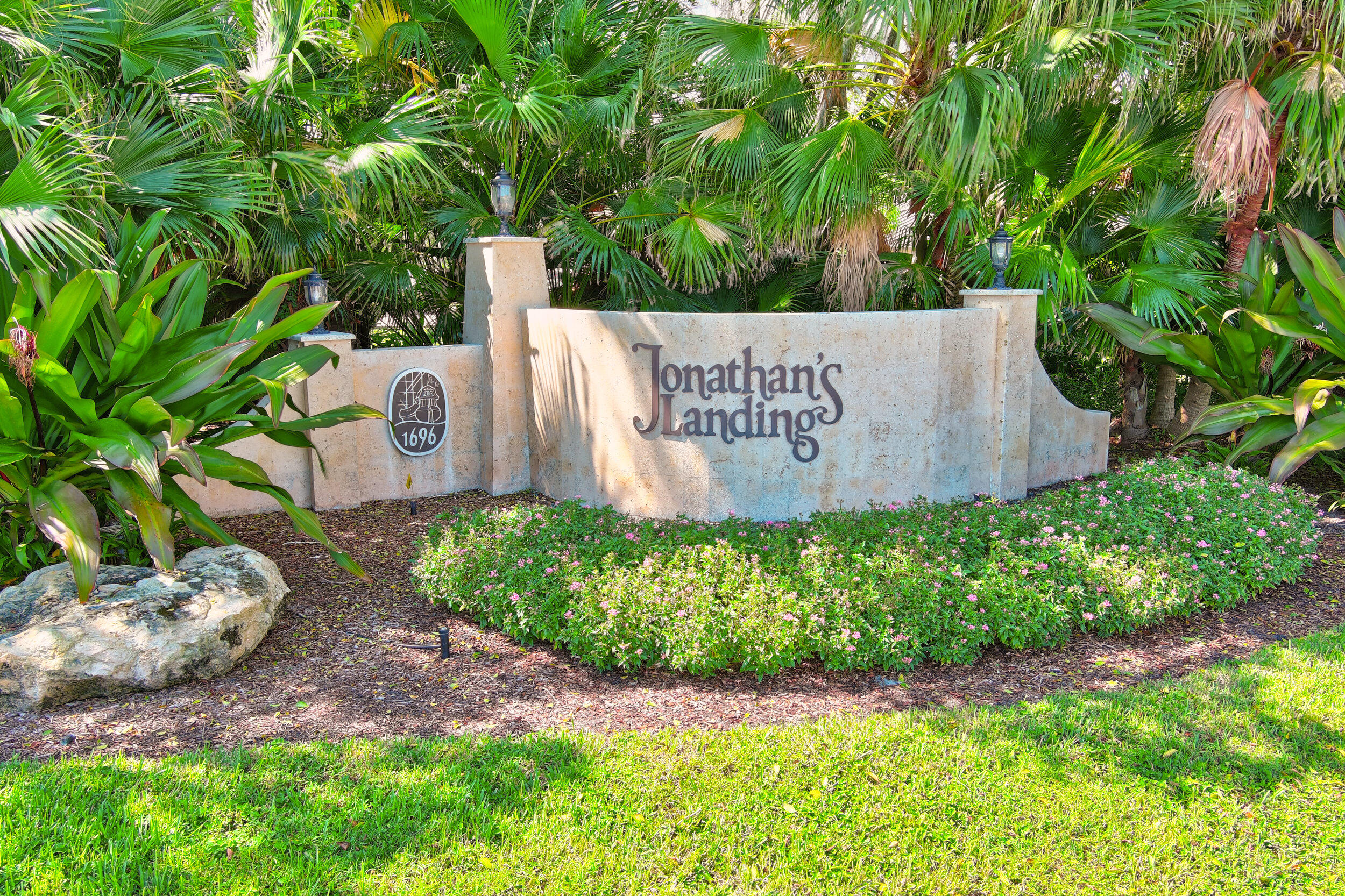 16623 Traders Crossing North, Unit 131 Jupiter, FL 33477 - Photo 41 of 42 a sign on the side of the road