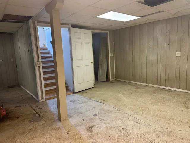 a view of an empty room with stairs