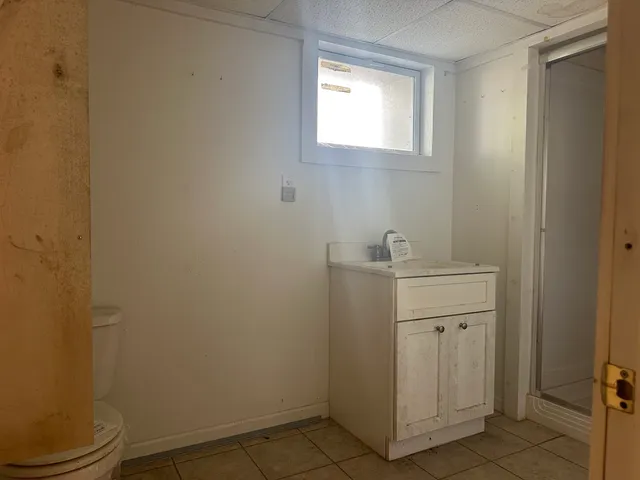 a bathroom with a toilet sink and vanity