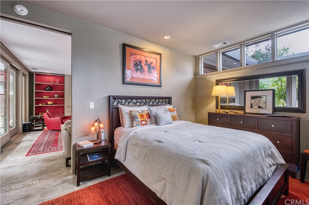 600 Chaparral Road Sierra Madre, CA 91024 - Photo 12 of 25 a bedroom with a bed and wooden floor