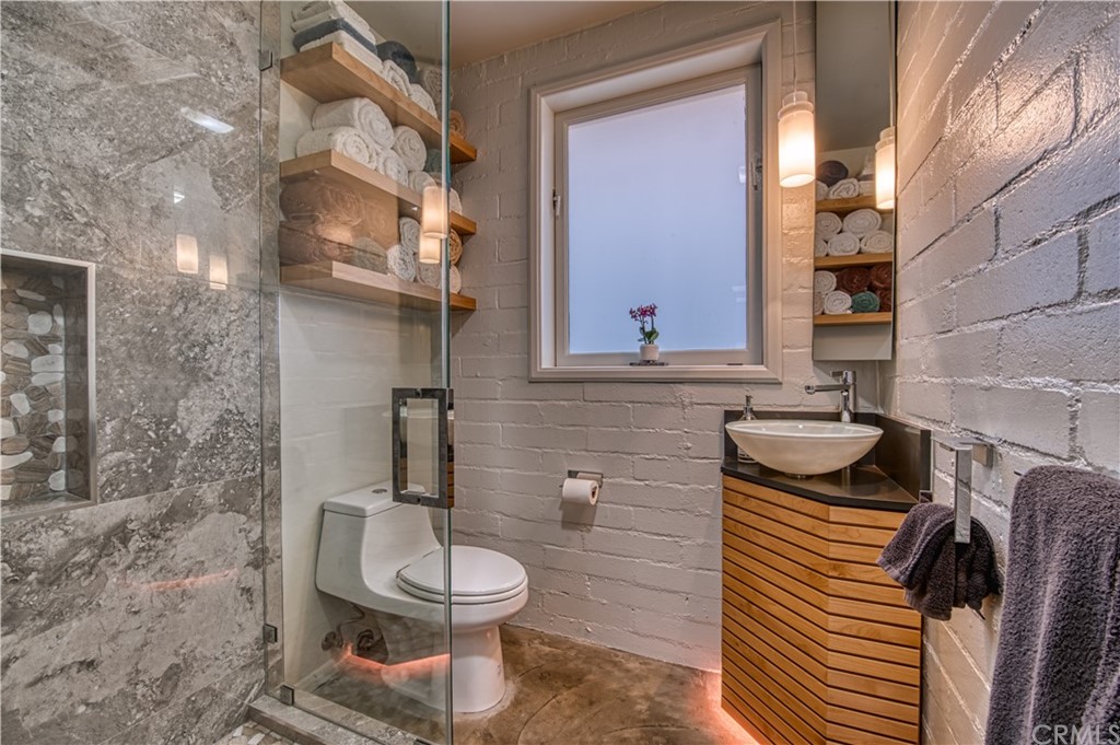 600 Chaparral Road Sierra Madre, CA 91024 - Photo 13 of 25 a bathroom with a toilet and a sink