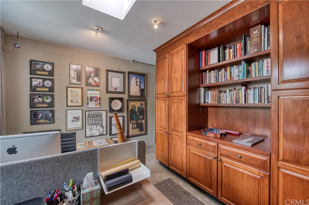 600 Chaparral Road Sierra Madre, CA 91024 - Photo 14 of 25 a living room with stainless steel furniture and a book shelf