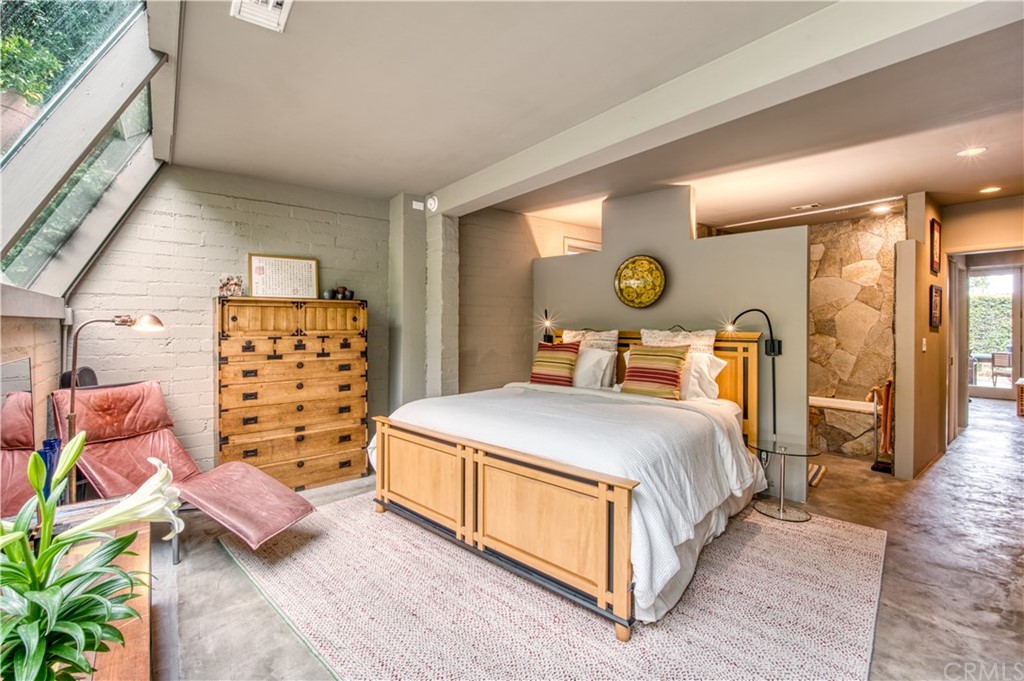 600 Chaparral Road Sierra Madre, CA 91024 - Photo 15 of 25 a bedroom with a bed and wooden floor