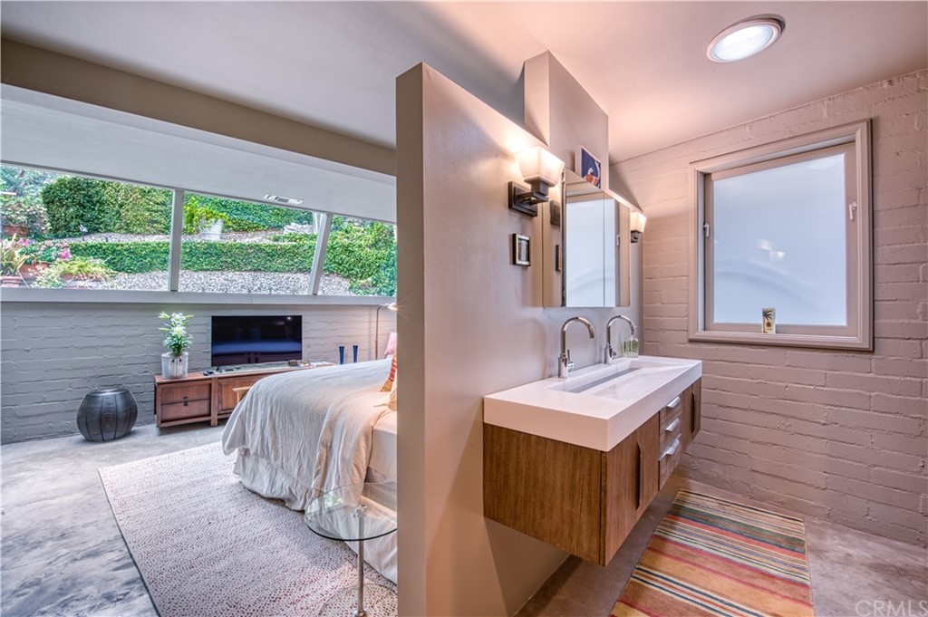 600 Chaparral Road Sierra Madre, CA 91024 - Photo 17 of 25 a bedroom with a bed and a large window