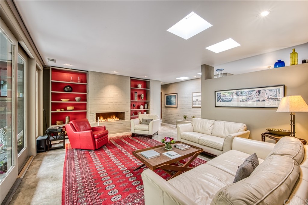 600 Chaparral Road Sierra Madre, CA 91024 - Photo 5 of 25 a living room with furniture and a flat screen tv