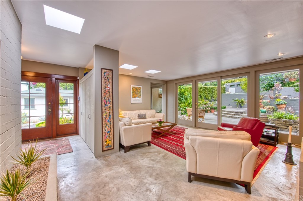600 Chaparral Road Sierra Madre, CA 91024 - Photo 6 of 25 a living room with furniture and large windows