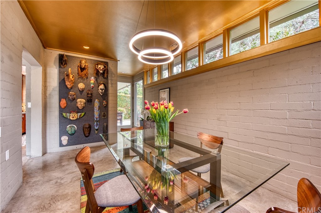 600 Chaparral Road Sierra Madre, CA 91024 - Photo 7 of 25 a dining room with furniture and wooden floor