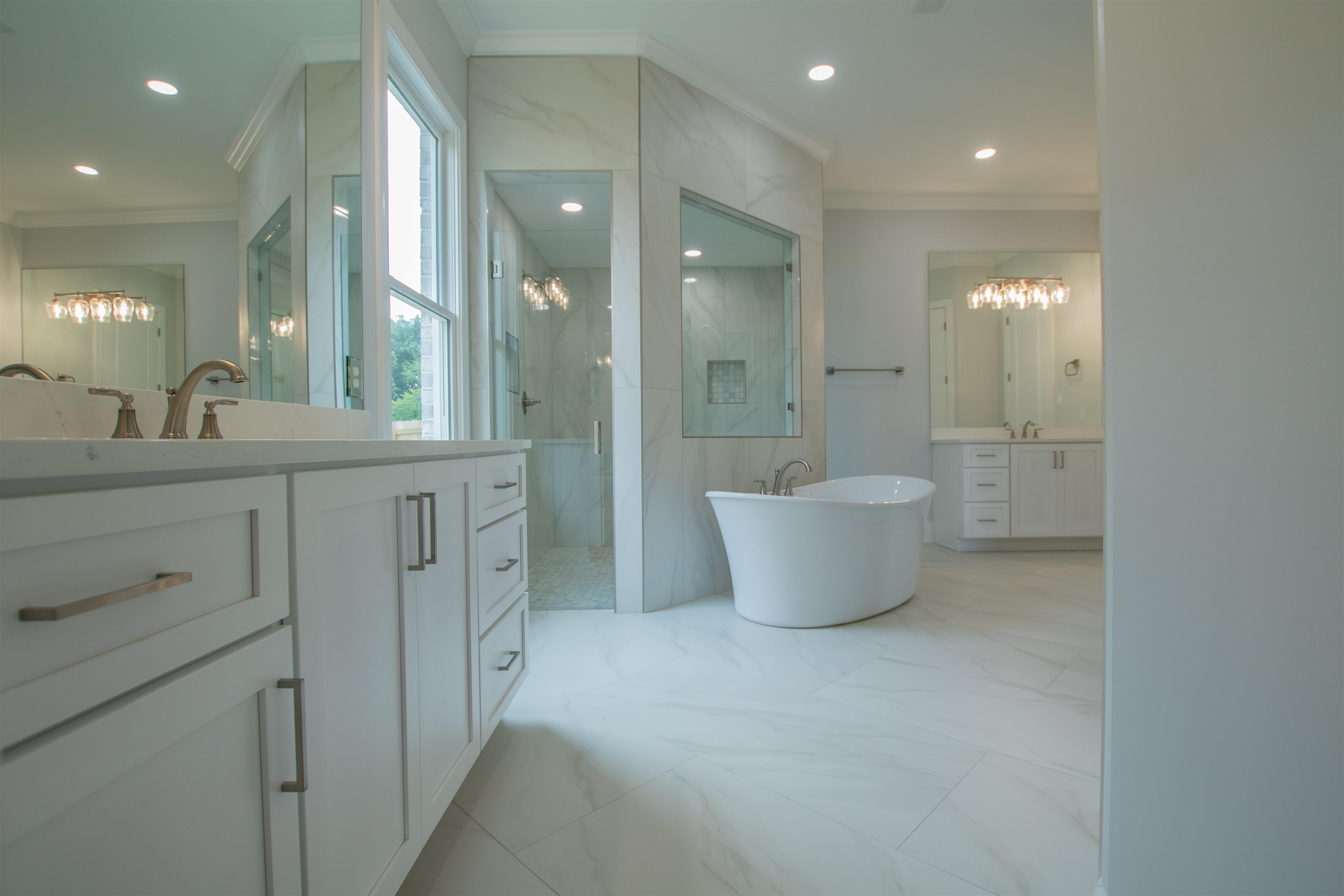 2611 Moore Road Germantown, TN 38138 - Photo 22 of 35 Bathroom featuring vanity, tile patterned flooring, tile walls, and a chandelier
