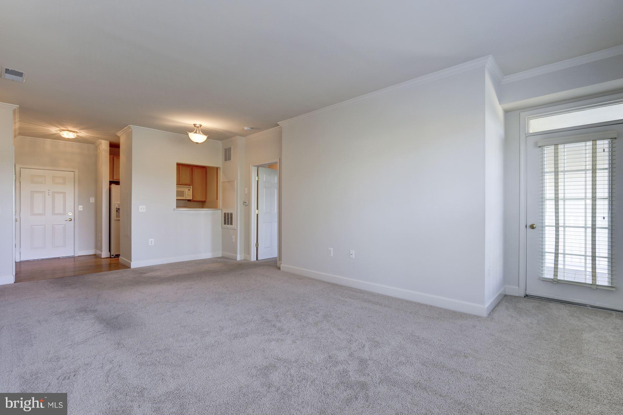 11924 Darnestown Road, Unit 305 Gaithersburg, MD 20878 - Photo 8 of 23 Living/Dining Room