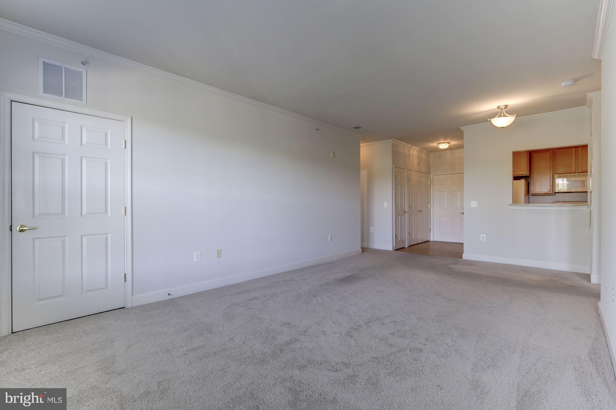 11924 Darnestown Road, Unit 305 Gaithersburg, MD 20878 - Photo 9 of 23 Living/Dining Room
