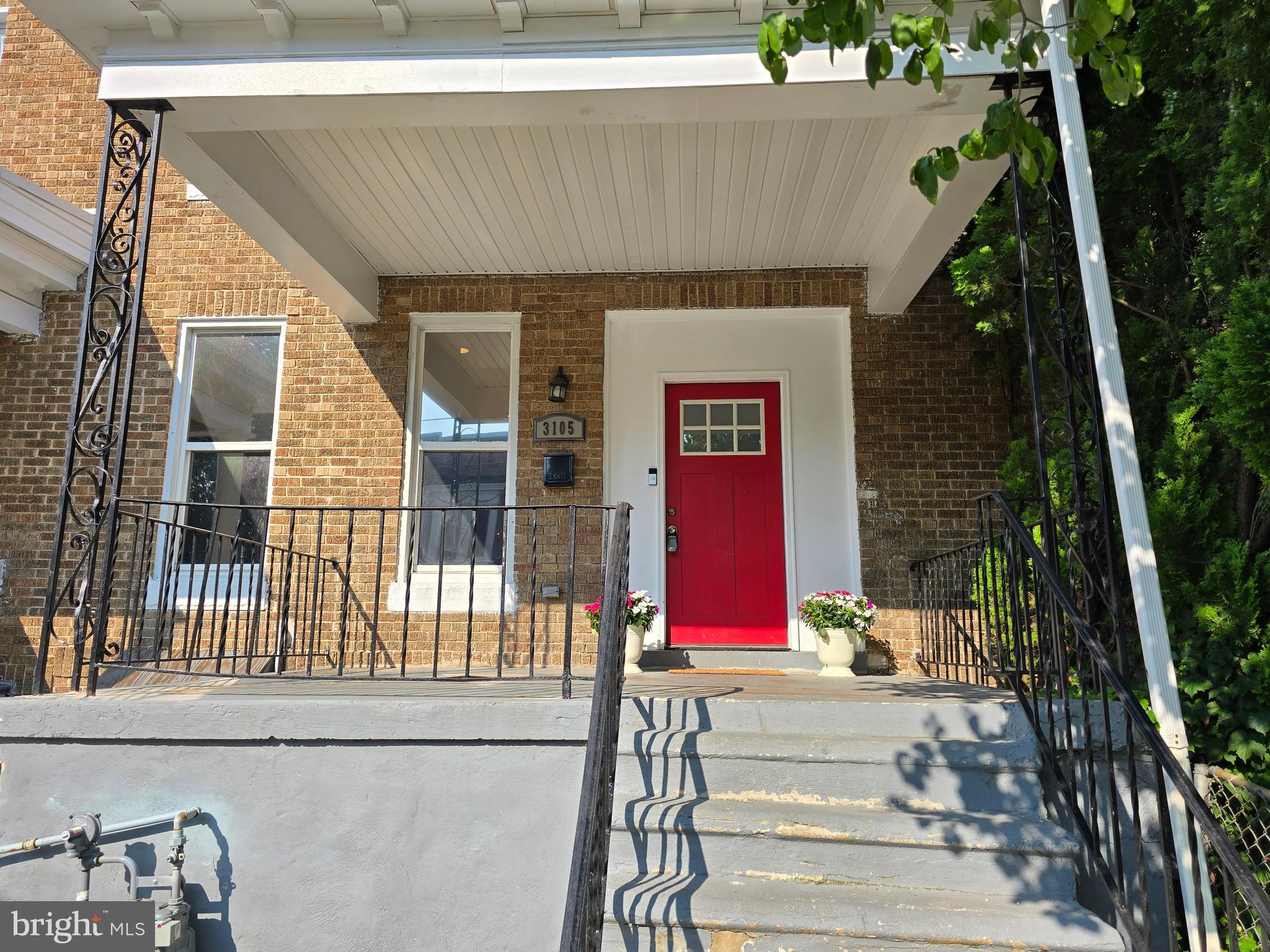 3105 Chelsea Terrace Baltimore, MD 21216 - Photo 2 of 58 a front view of a house with a yard