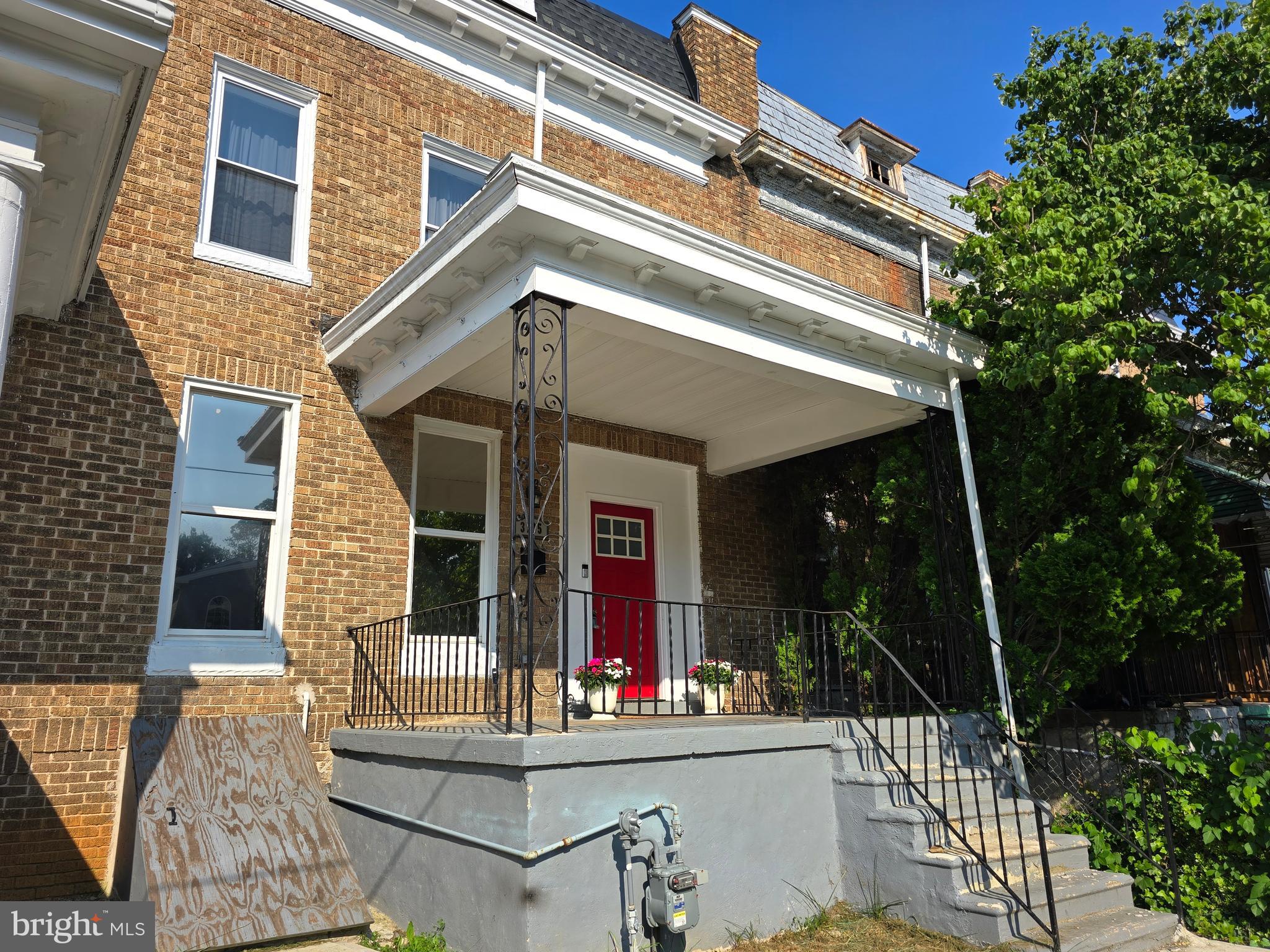 3105 Chelsea Terrace Baltimore, MD 21216 - Photo 3 of 58 front view of house with patio
