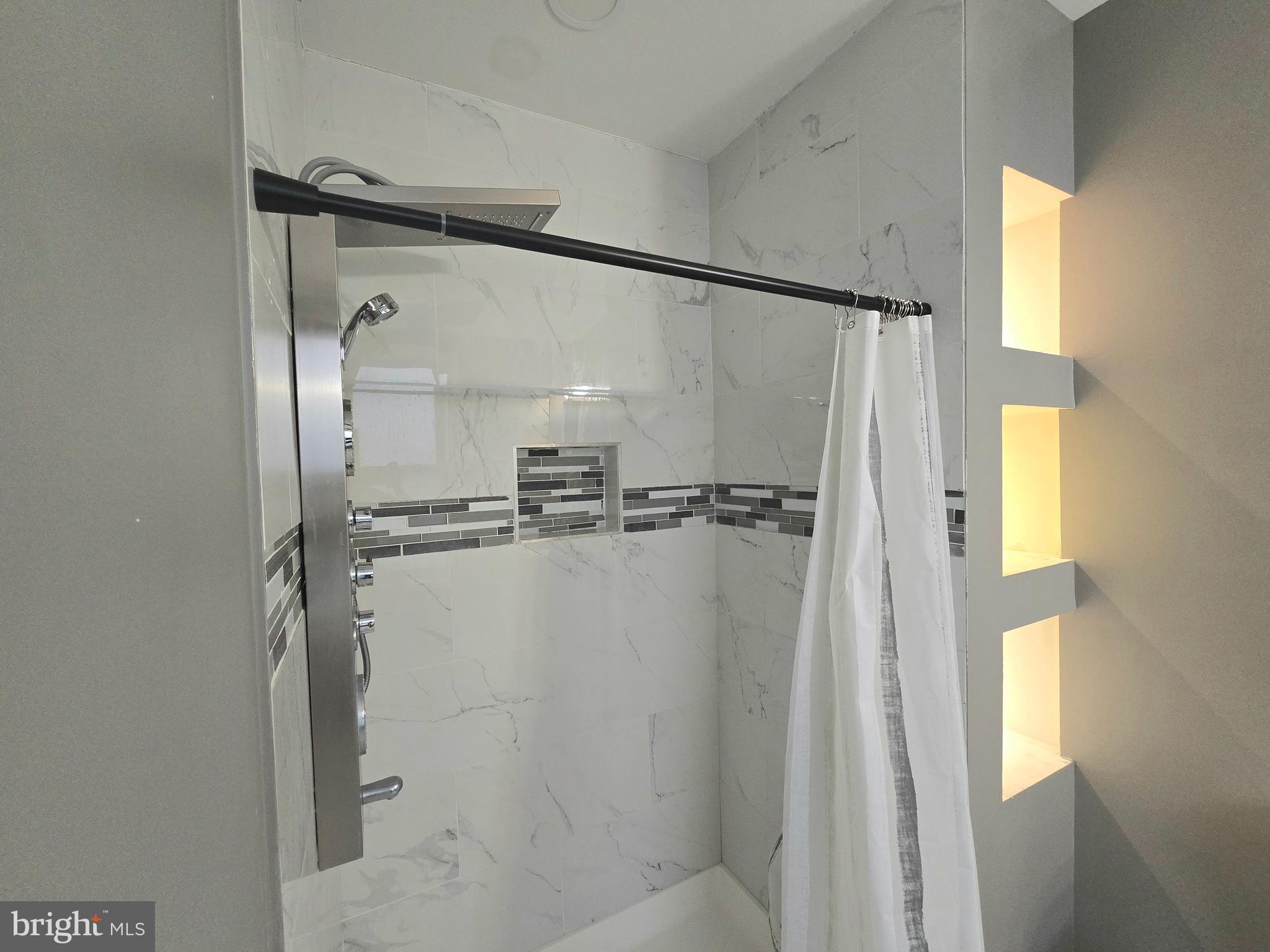 3105 Chelsea Terrace Baltimore, MD 21216 - Photo 40 of 58 a bathroom with a glass shower door