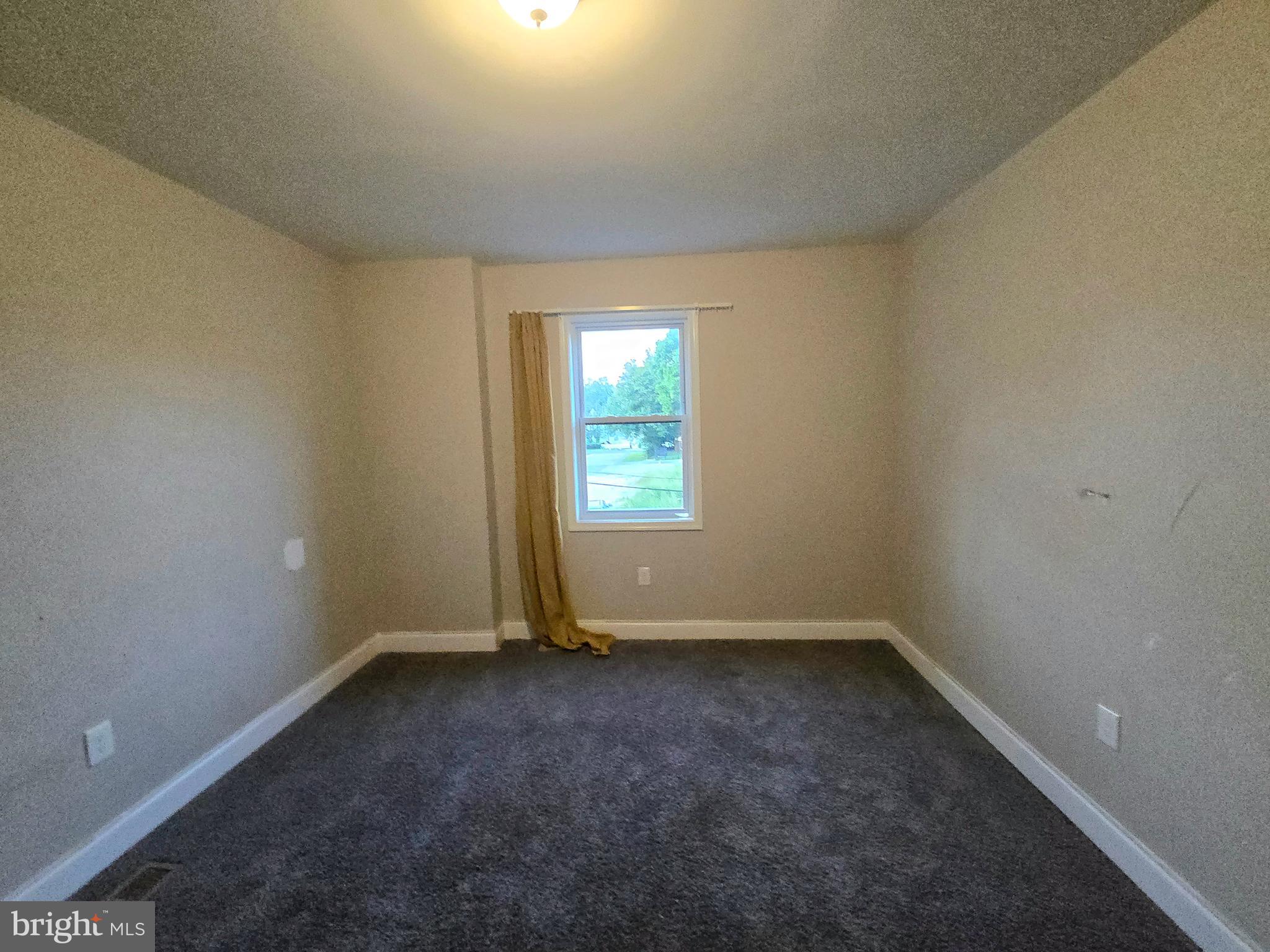 3105 Chelsea Terrace Baltimore, MD 21216 - Photo 48 of 58 an empty room with a window