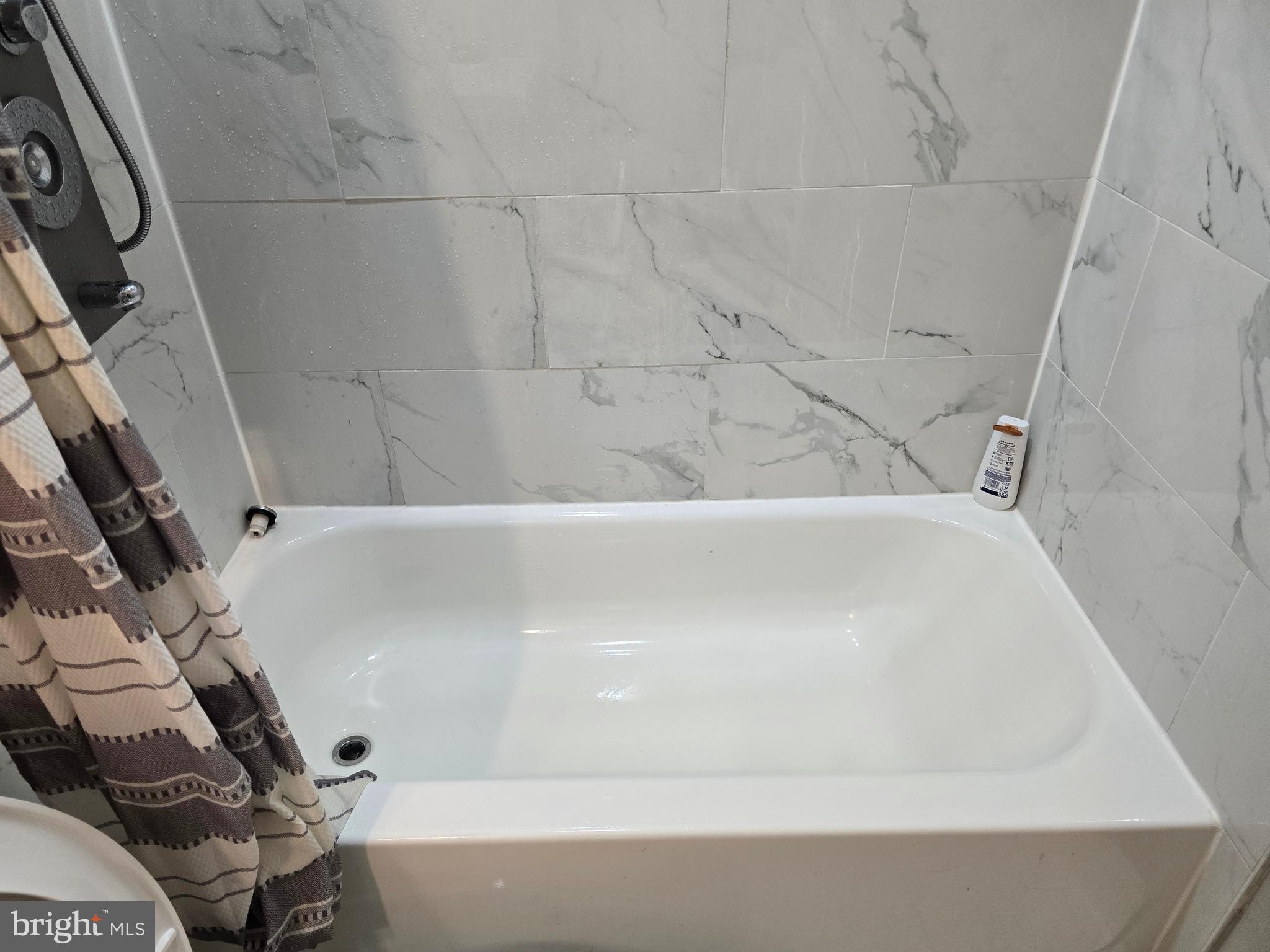 3105 Chelsea Terrace Baltimore, MD 21216 - Photo 54 of 58 a bathroom with a bathtub