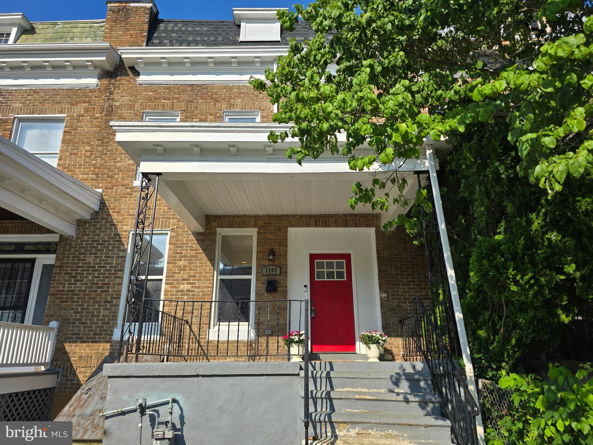 3105 Chelsea Terrace Baltimore, MD 21216 - Photo 6 of 58 front view of a house with a tree