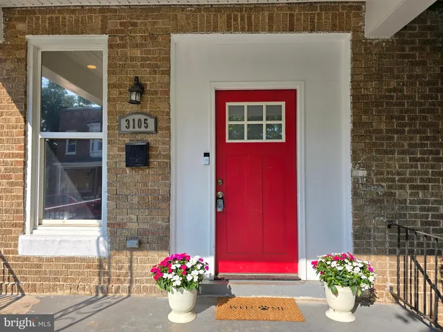 a flower pot with red door