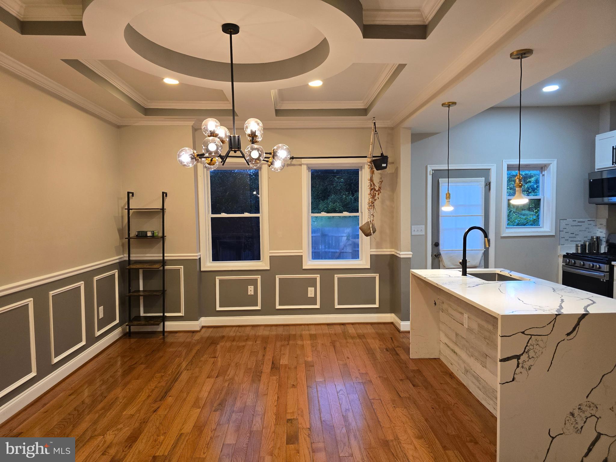 3105 Chelsea Terrace Baltimore, MD 21216 - Photo 9 of 58 a living room with furniture and a chandelier