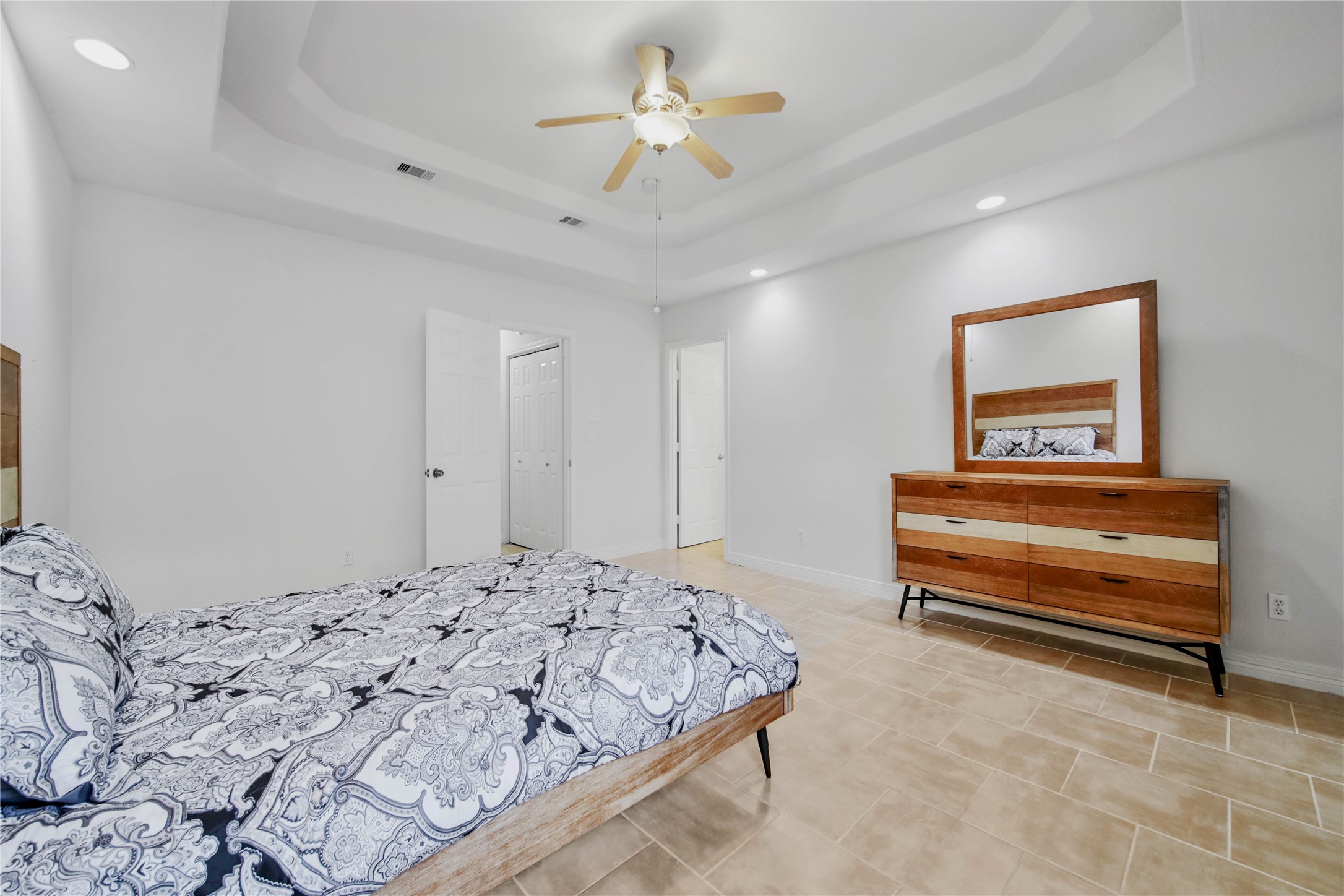 4943 Gammage Street Houston, TX 77021 - Photo 15 of 22 a bedroom with a bed and a chandelier