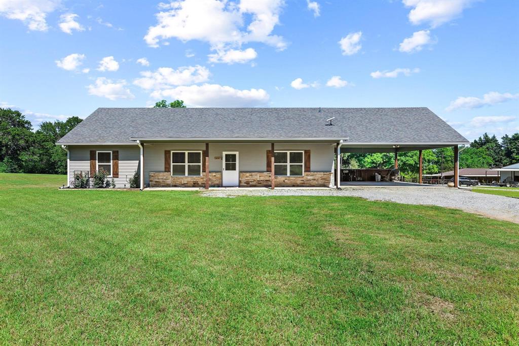 2658 Oak Ridge Road Denison, TX 75021 - Photo 1 of 37 a front view of a house with a yard