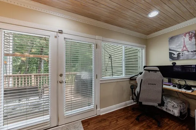 a view of a wooden chairs on the deck