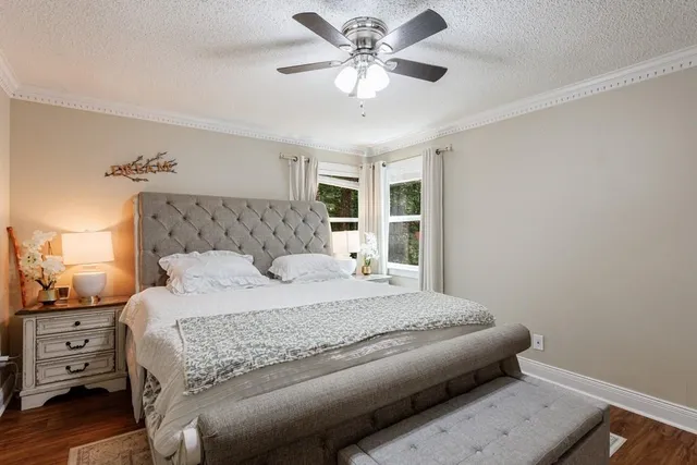 a bathroom with a double vanity sink mirror and toilet