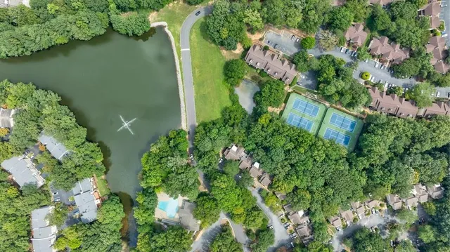 a view of a house with a yard and sitting area