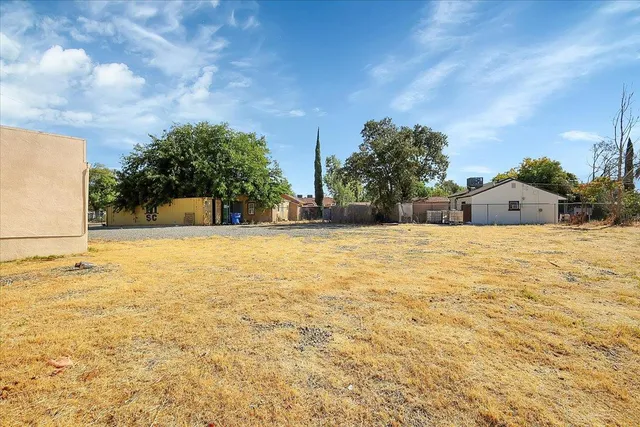 a view of pool of water with palm trees