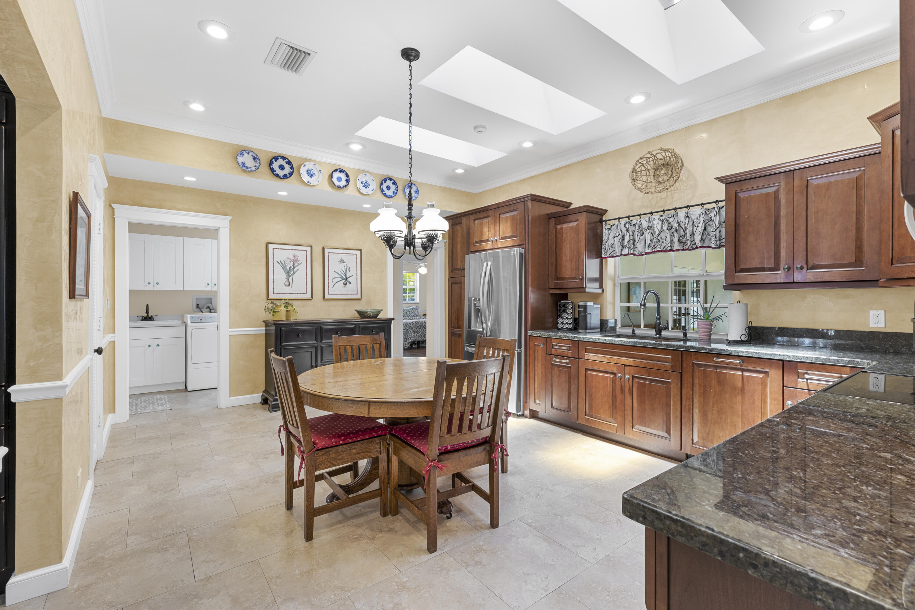 7501 Plantation Road Plantation, FL 33317 - Photo 11 of 57 a large kitchen with a table and chairs