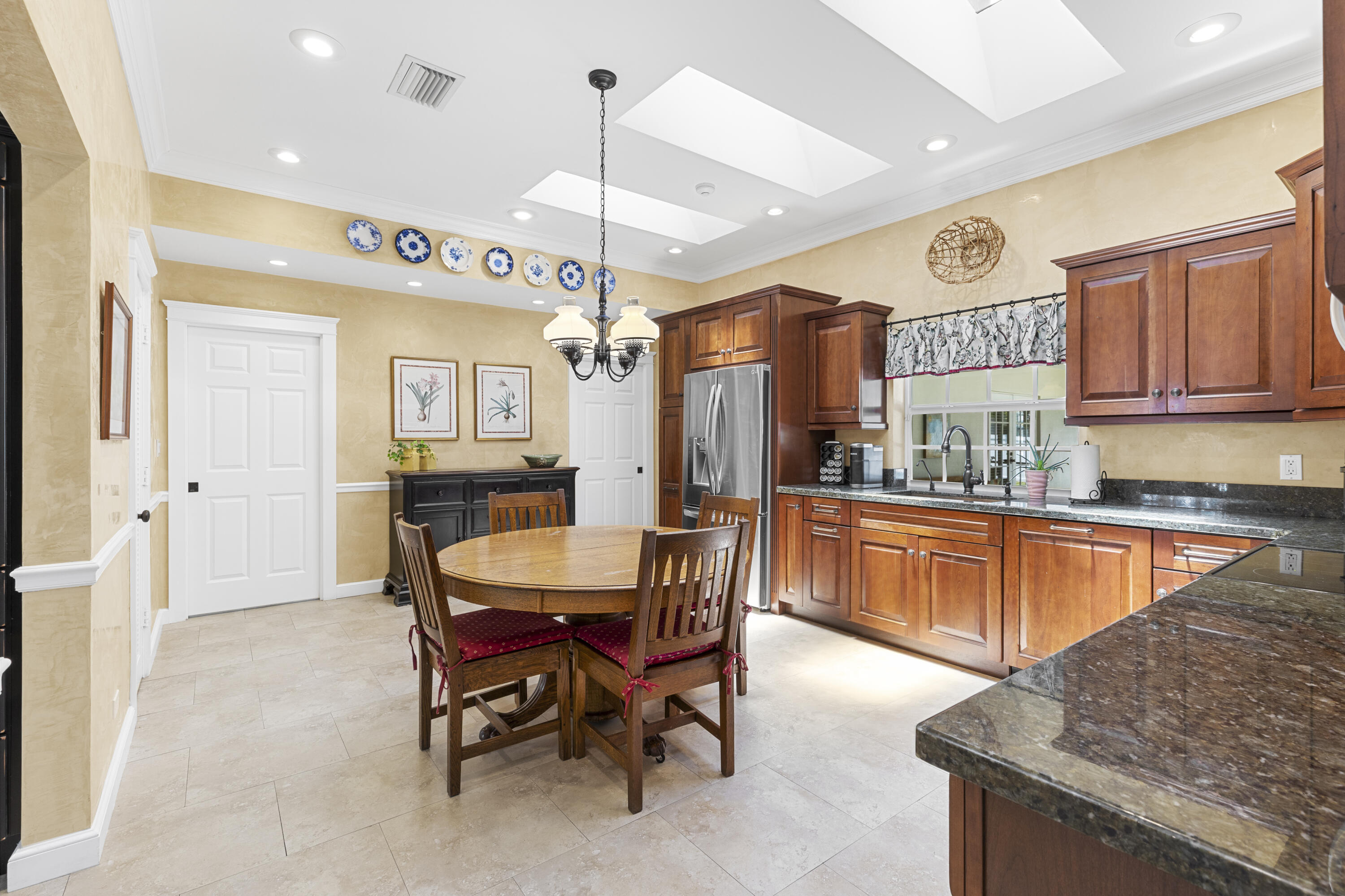 7501 Plantation Road Plantation, FL 33317 - Photo 12 of 57 a large kitchen with a table and chairs