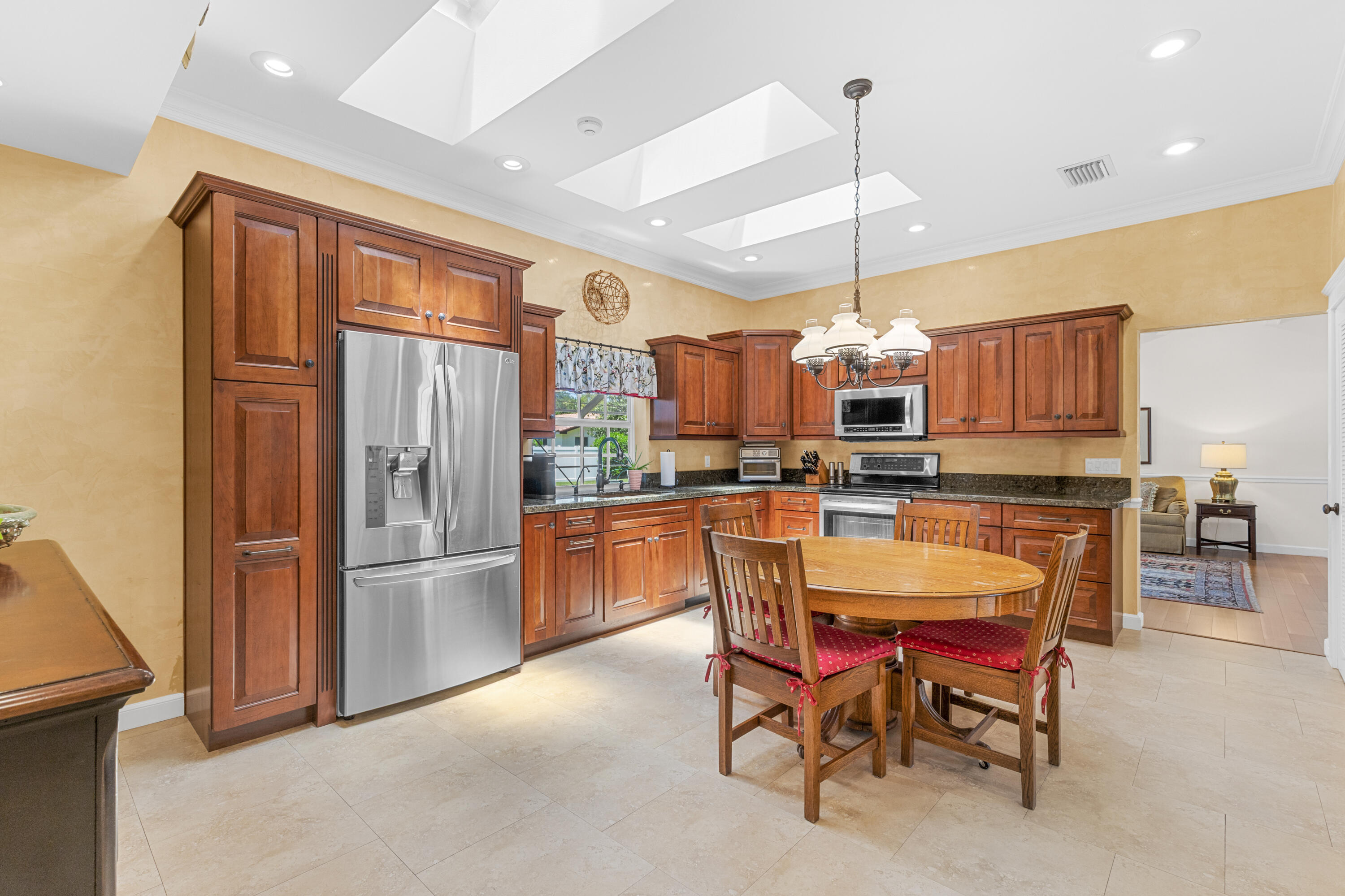 7501 Plantation Road Plantation, FL 33317 - Photo 14 of 57 a dining room filled with furniture and a chandelier