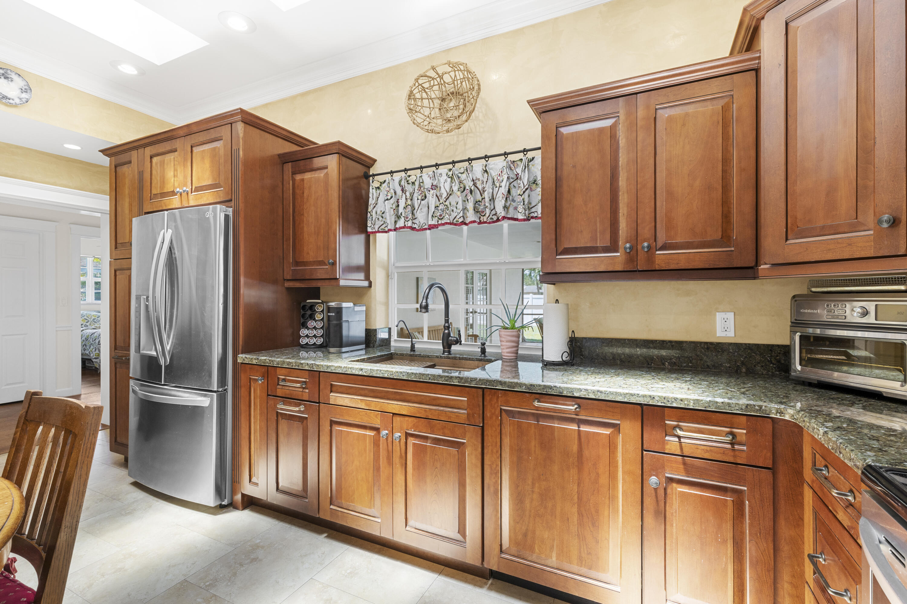 7501 Plantation Road Plantation, FL 33317 - Photo 15 of 57 a kitchen with stainless steel appliances granite countertop a refrigerator and a sink