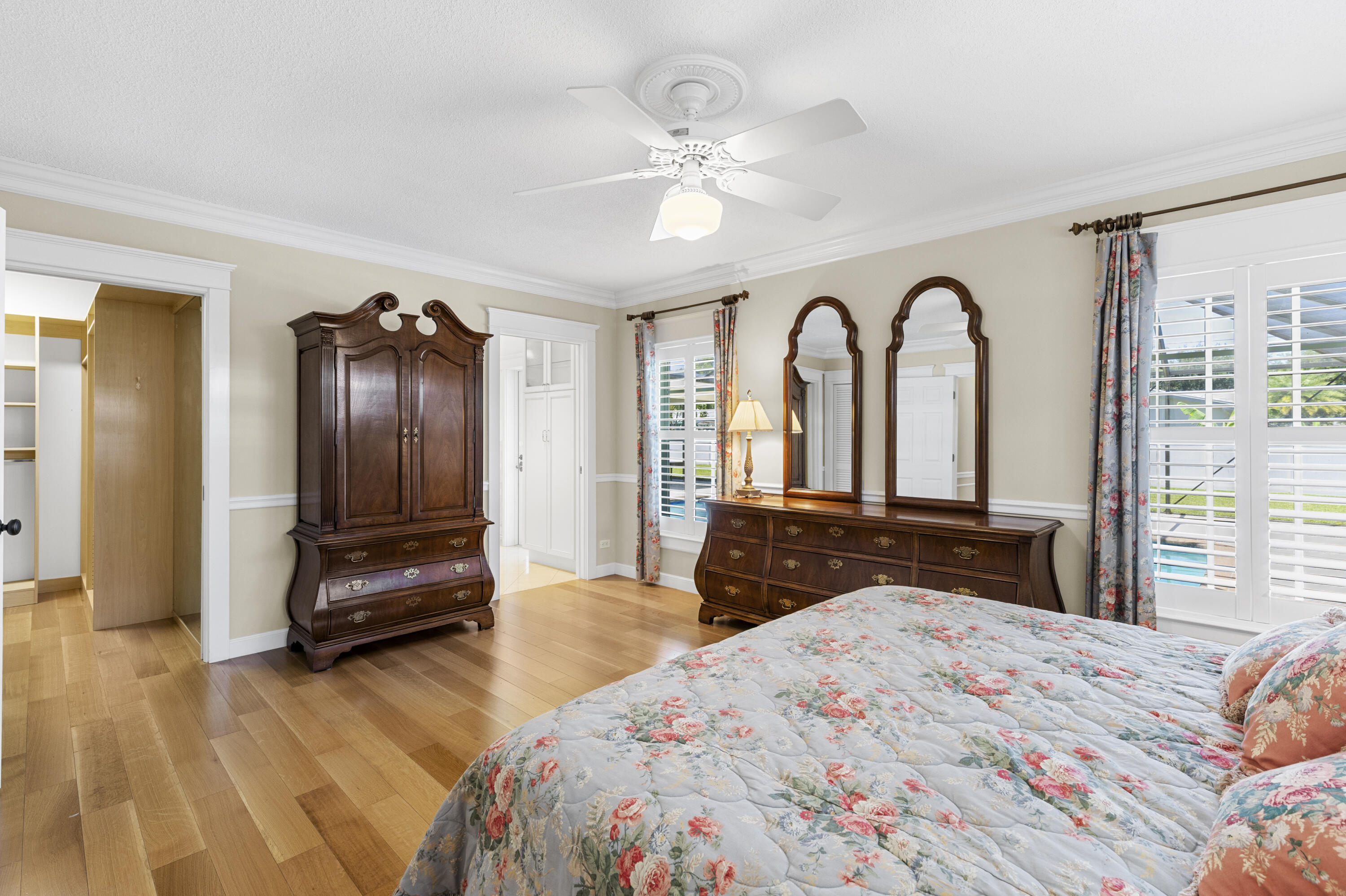7501 Plantation Road Plantation, FL 33317 - Photo 17 of 57 a bedroom with a bed and dresser with mirror