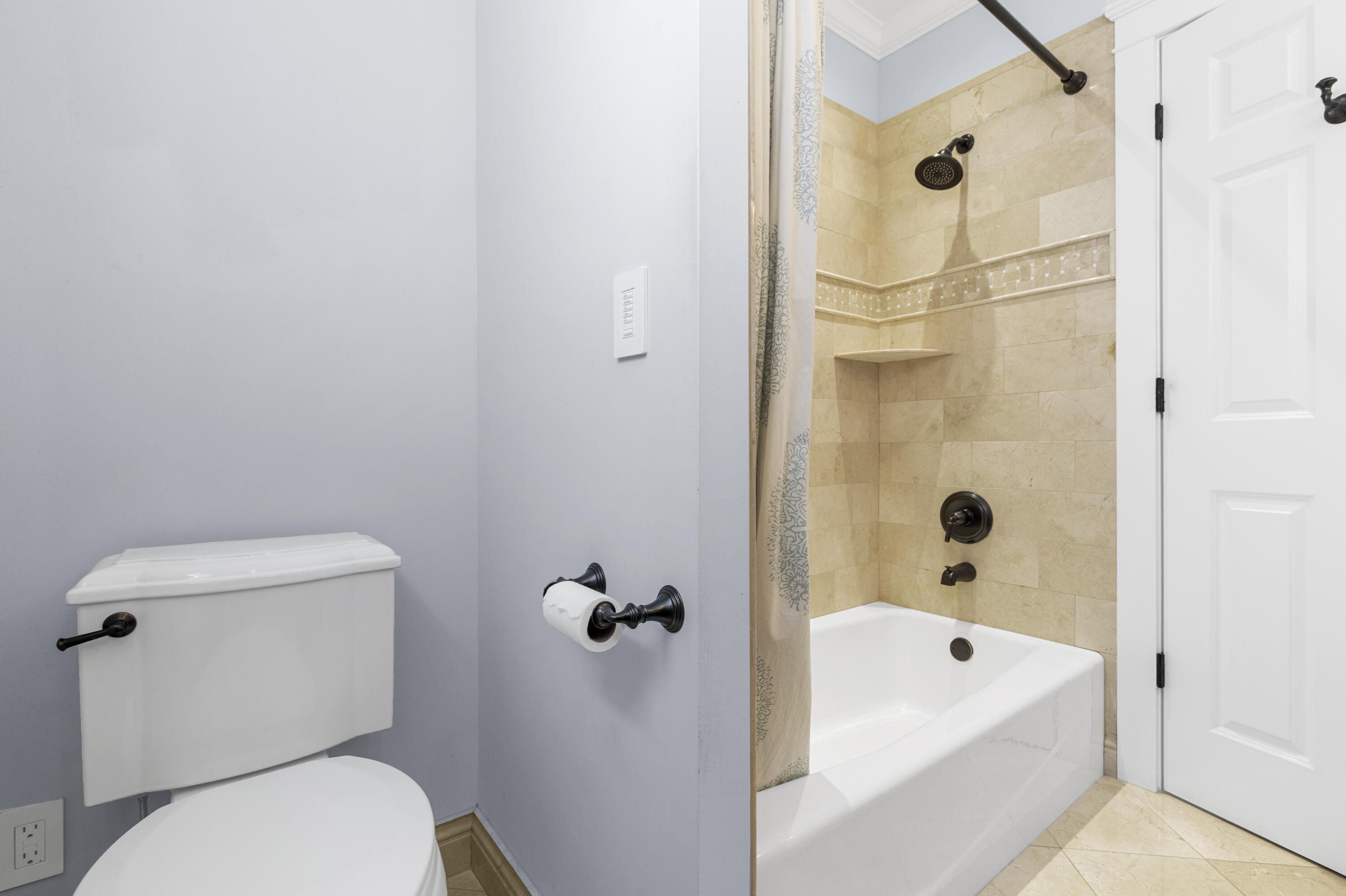7501 Plantation Road Plantation, FL 33317 - Photo 23 of 57 a white toilet sitting next to a bath tub