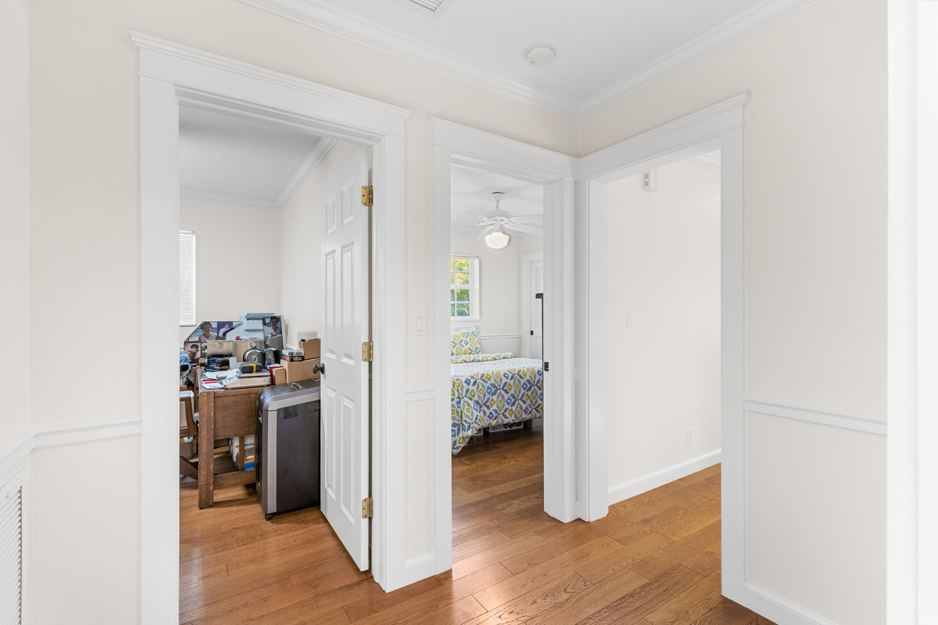 7501 Plantation Road Plantation, FL 33317 - Photo 30 of 57 a view of a hallway with bathroom and wooden floor