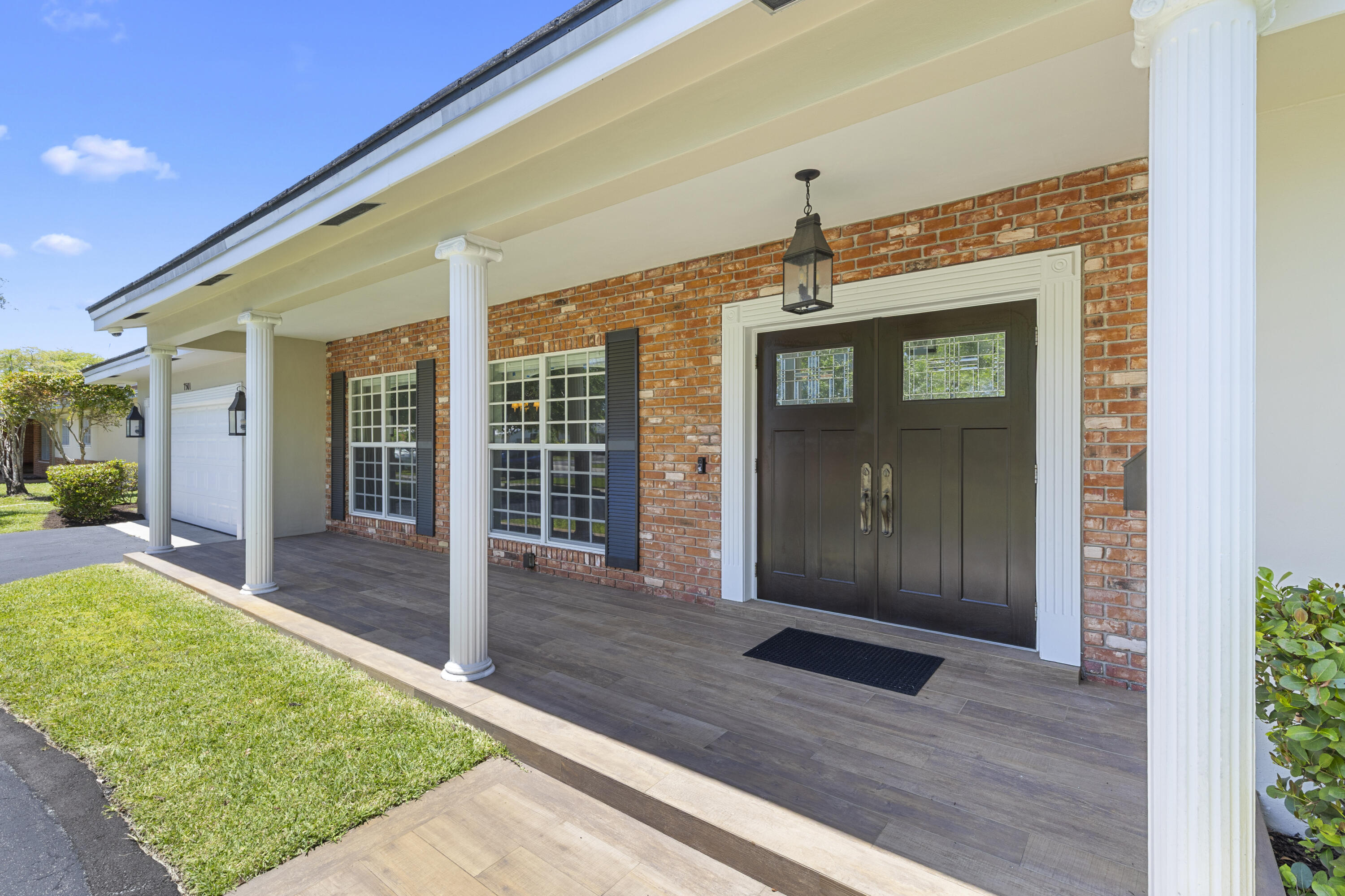 7501 Plantation Road Plantation, FL 33317 - Photo 48 of 57 a front view of a house with a yard