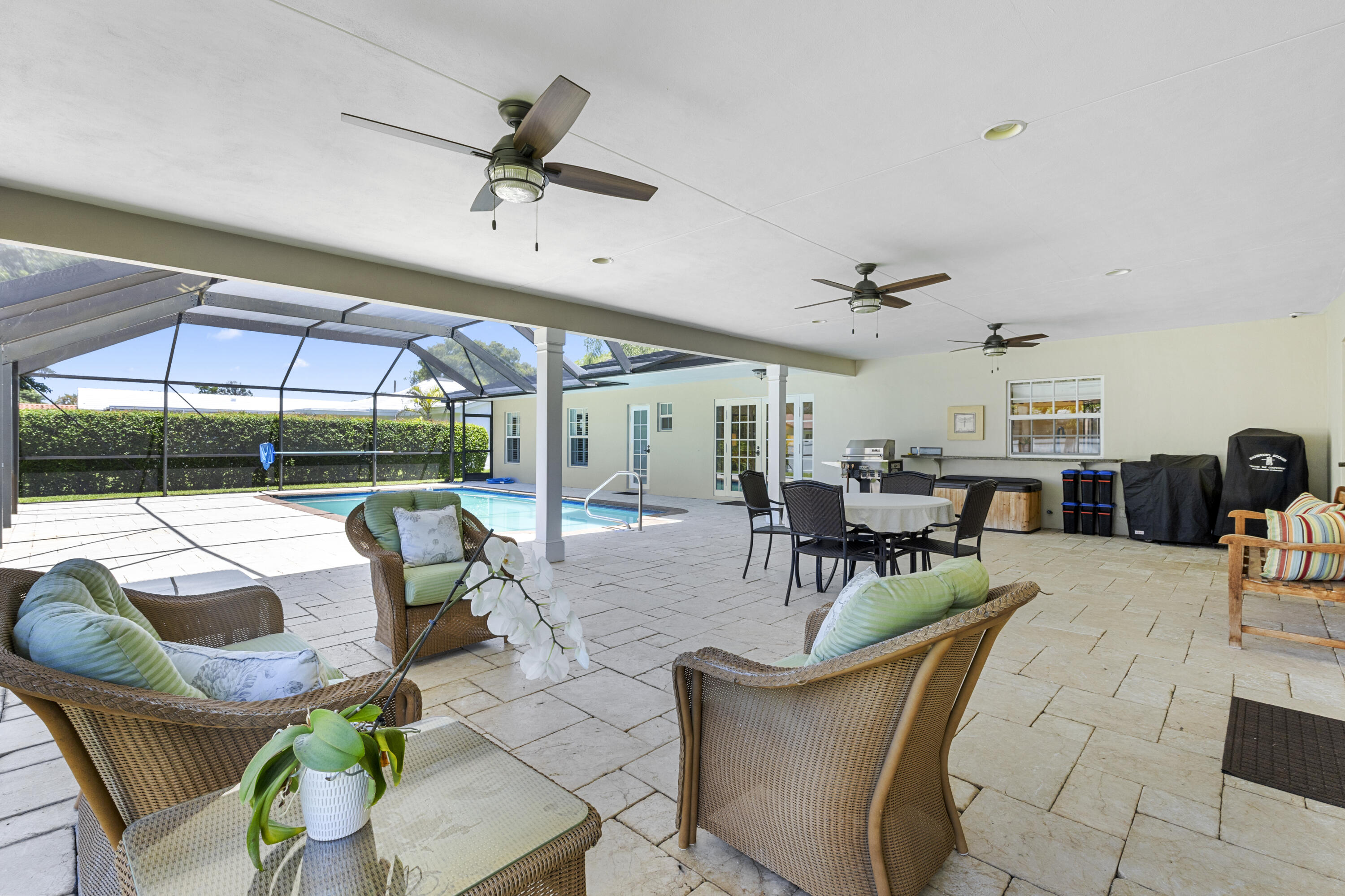 7501 Plantation Road Plantation, FL 33317 - Photo 5 of 57 a living room with patio furniture and a large window