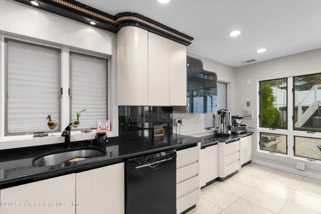 a kitchen with a sink and cabinets