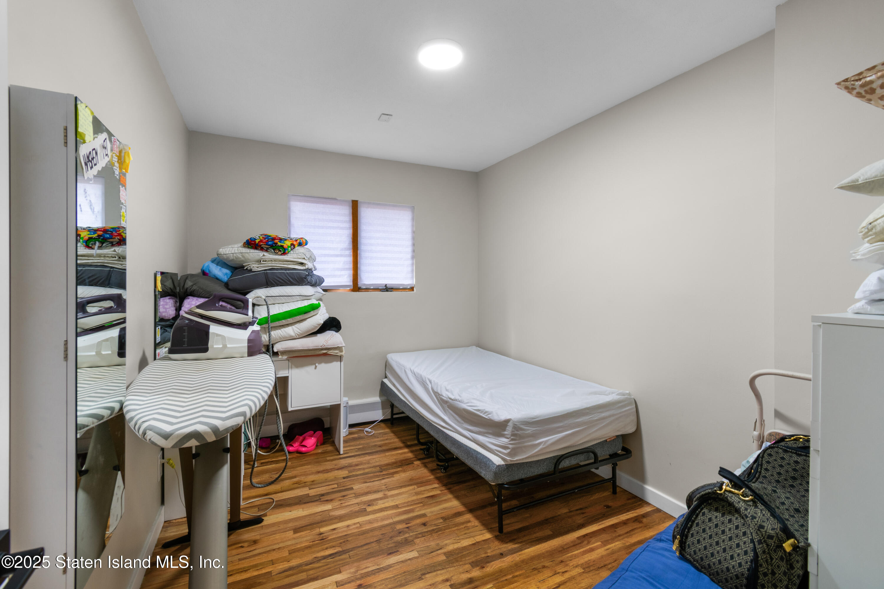 16 Ismay Street Staten Island, NY 10314 - Photo 19 of 39 a bedroom with a bed and a window