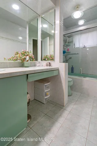 a bathroom with a sink and mirror