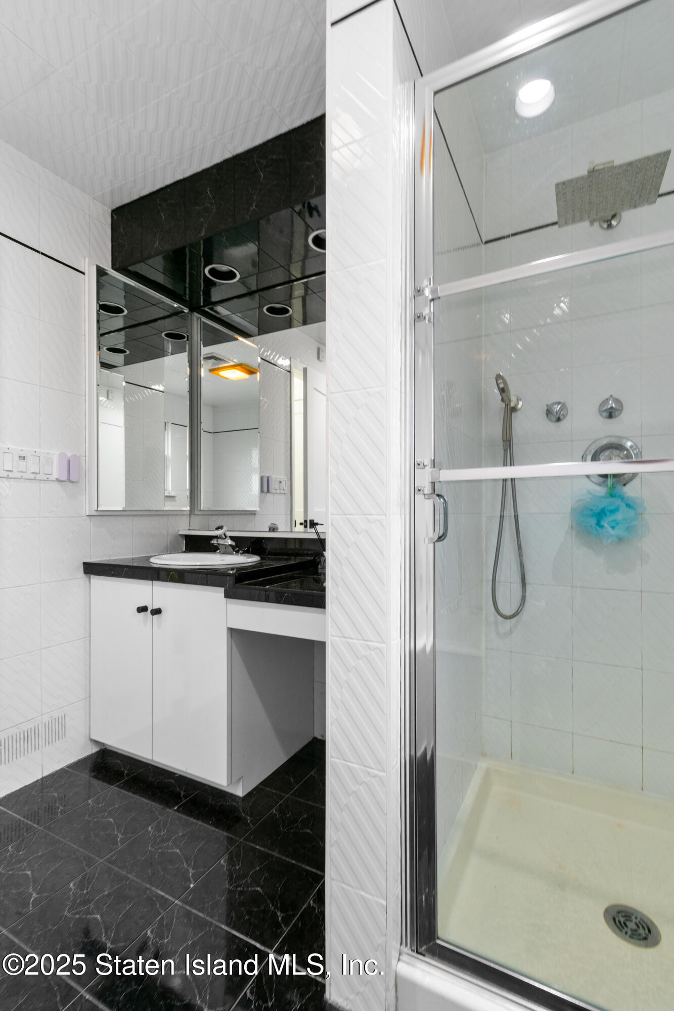 16 Ismay Street Staten Island, NY 10314 - Photo 29 of 39 a bathroom with a shower and a sink