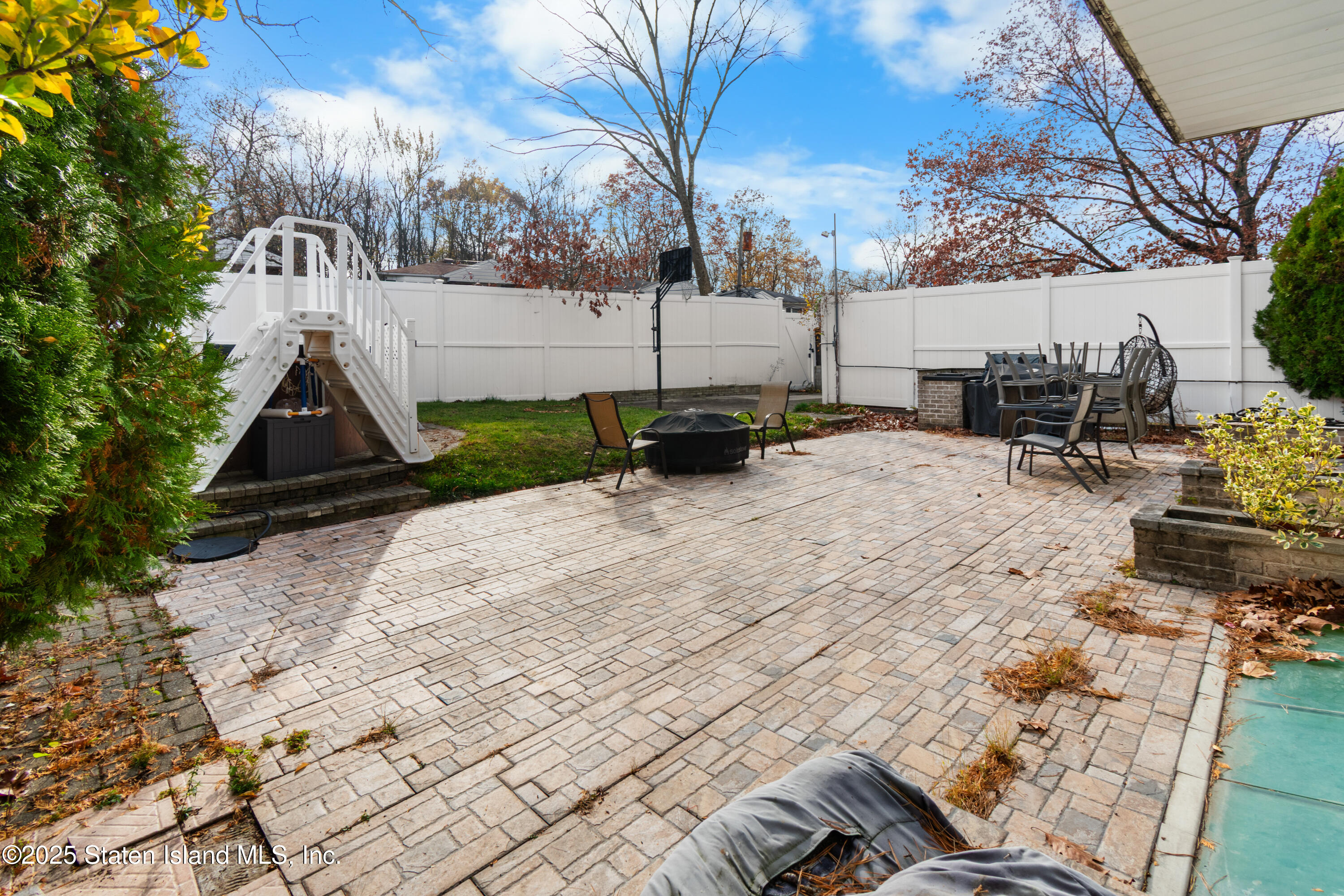 16 Ismay Street Staten Island, NY 10314 - Photo 36 of 39 a street view with tall trees